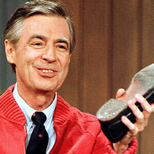 Mr. Rogers holding his shoe